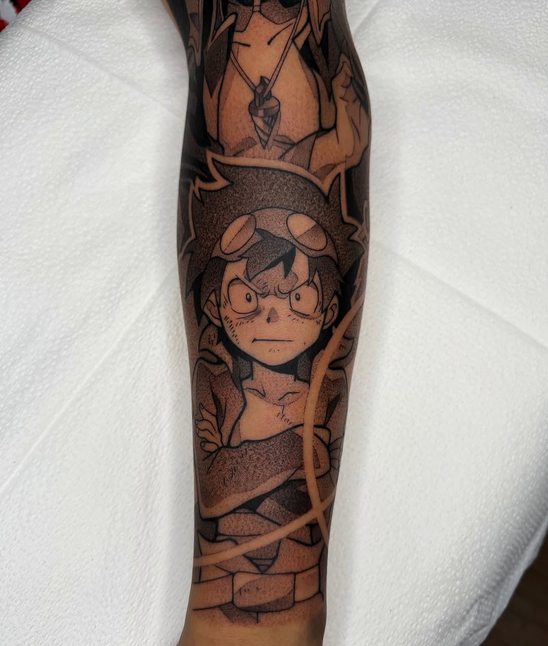 Tattoo by @z__tattoos — anime, black_and_grey