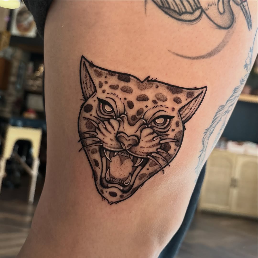 Tattoo by @strangegraves.ink — blackwork, illustrative