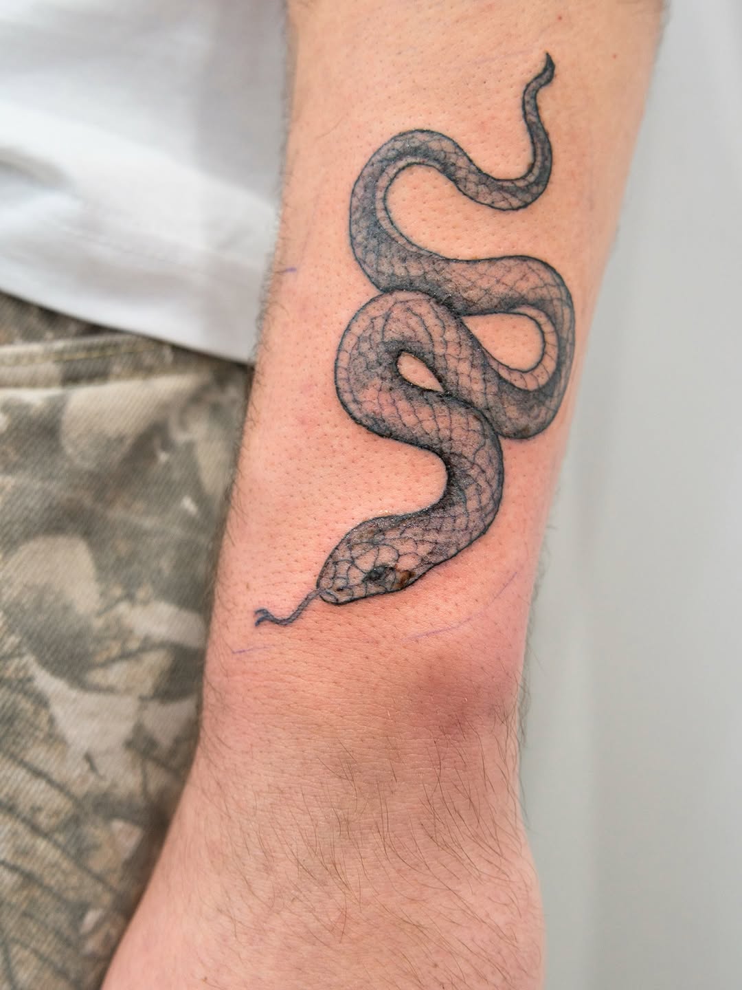 Tattoo by @wild_waves_ink — black_and_grey, realism