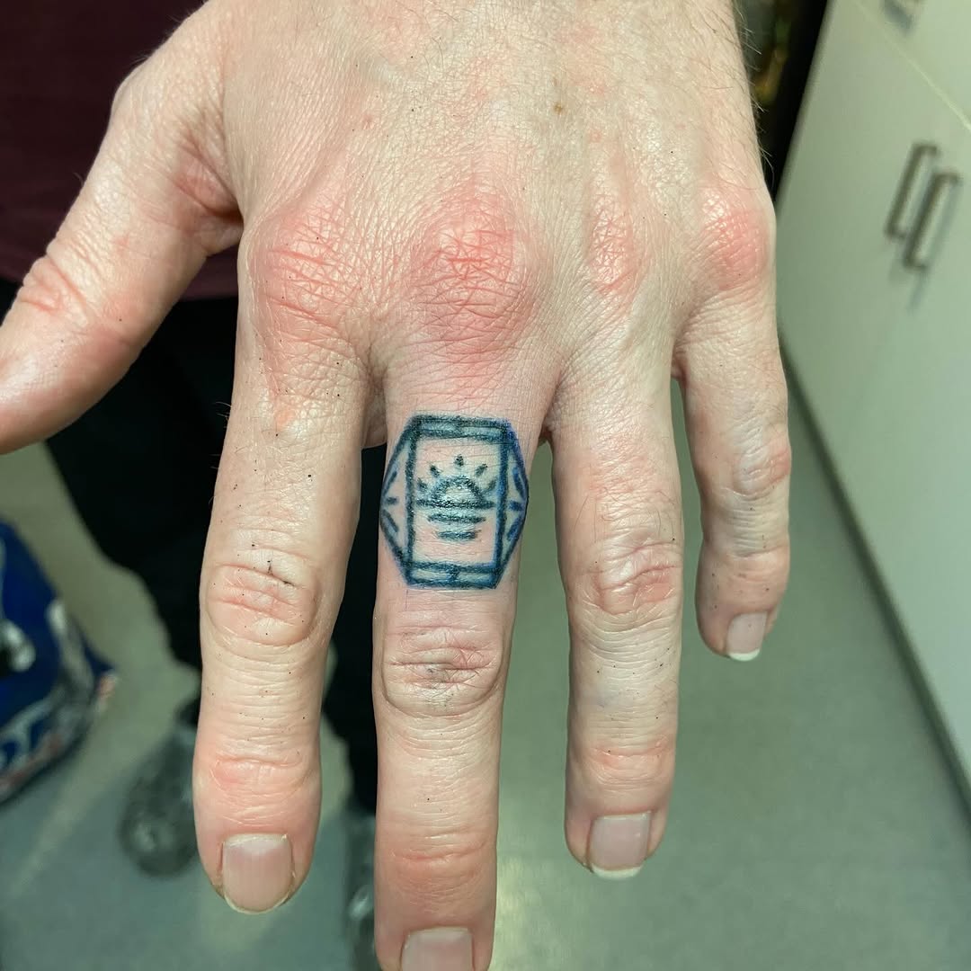 Tattoo by @deadboypokes — geometric, minimalist