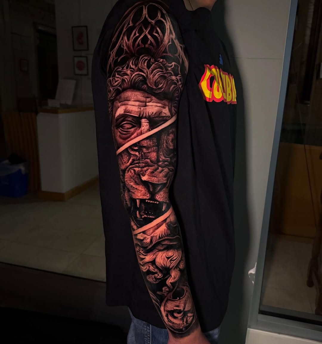 Tattoo by @rex.ink98 — realism, black_and_grey