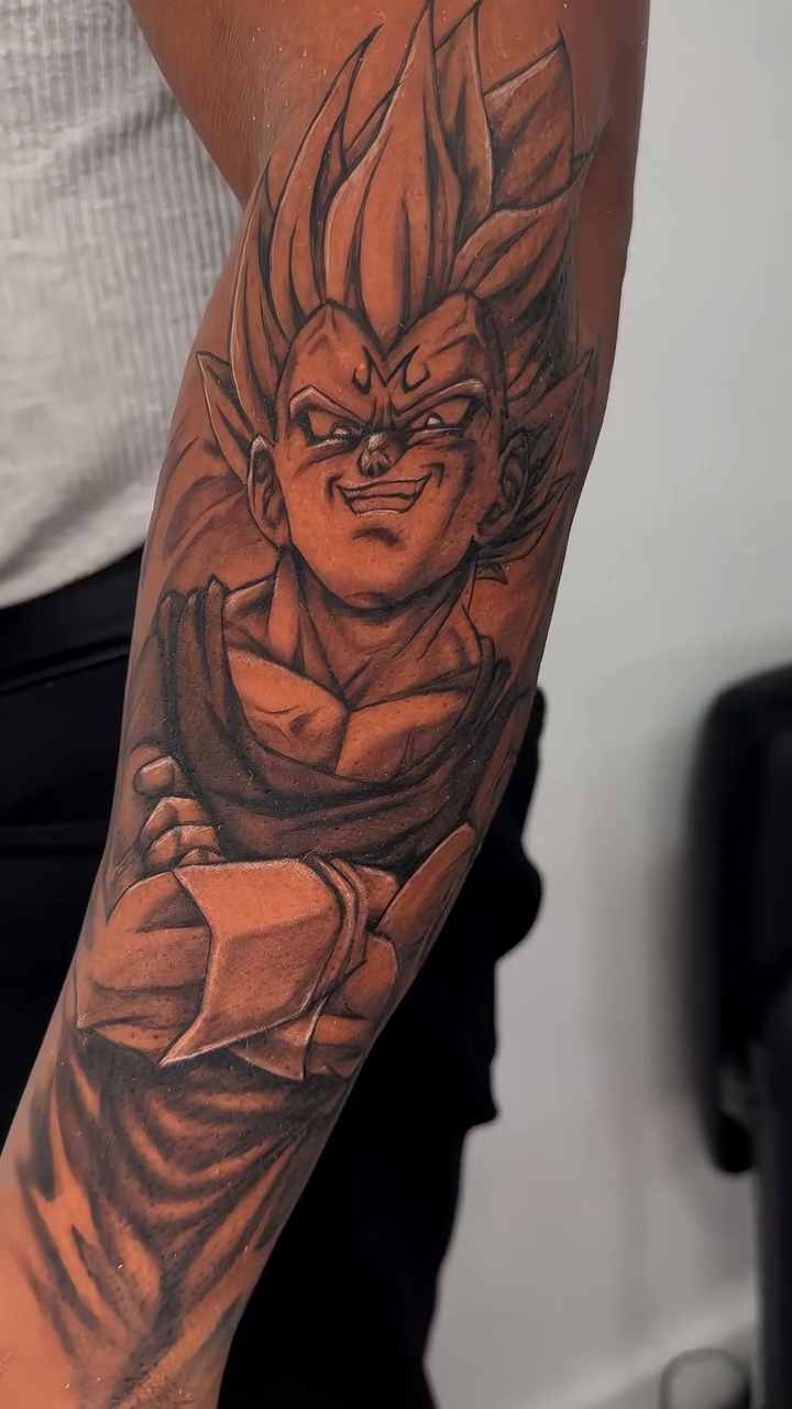 Tattoo by @grin_nyc — realism, anime