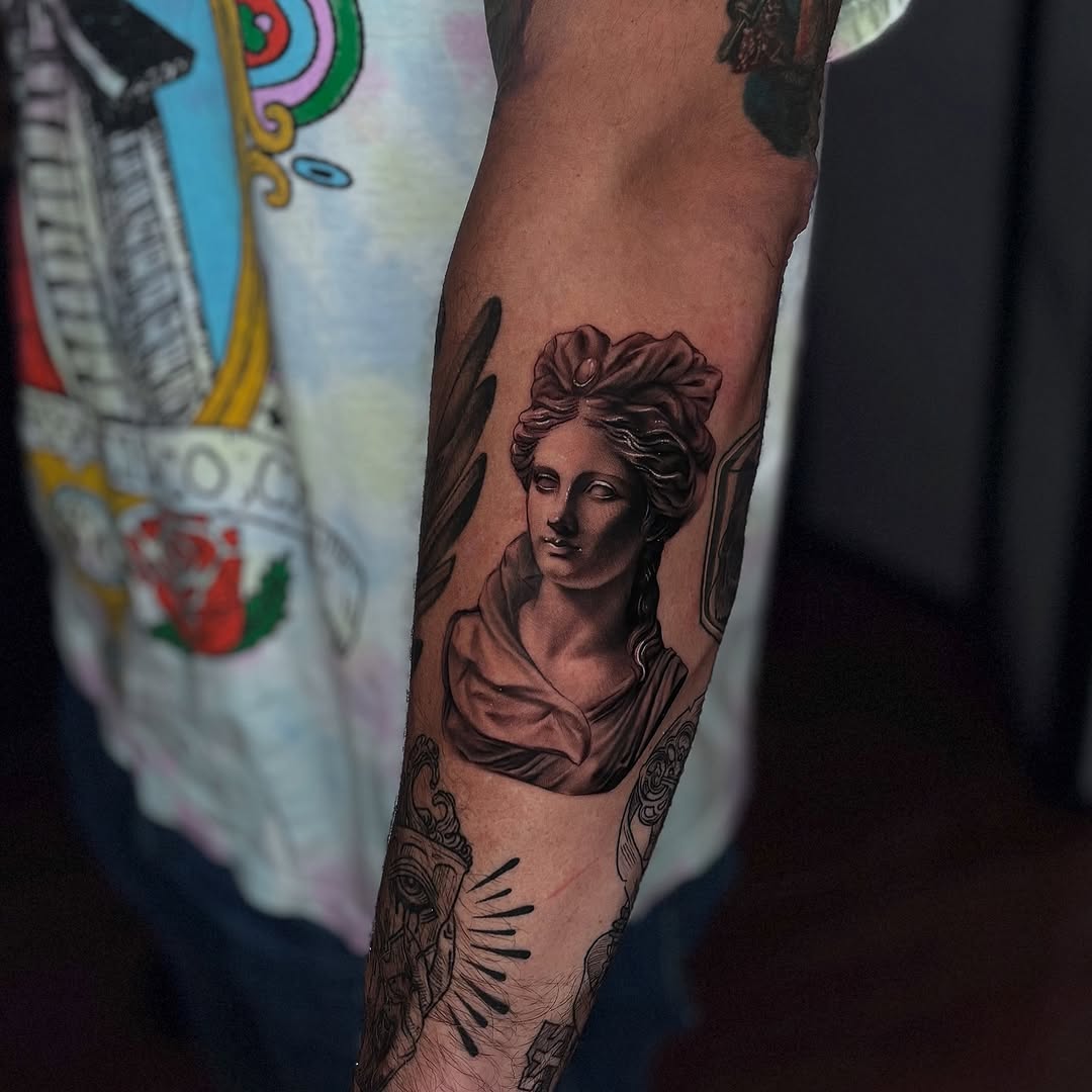 Tattoo by @stretched.marks.tattoo — realism, black_and_grey