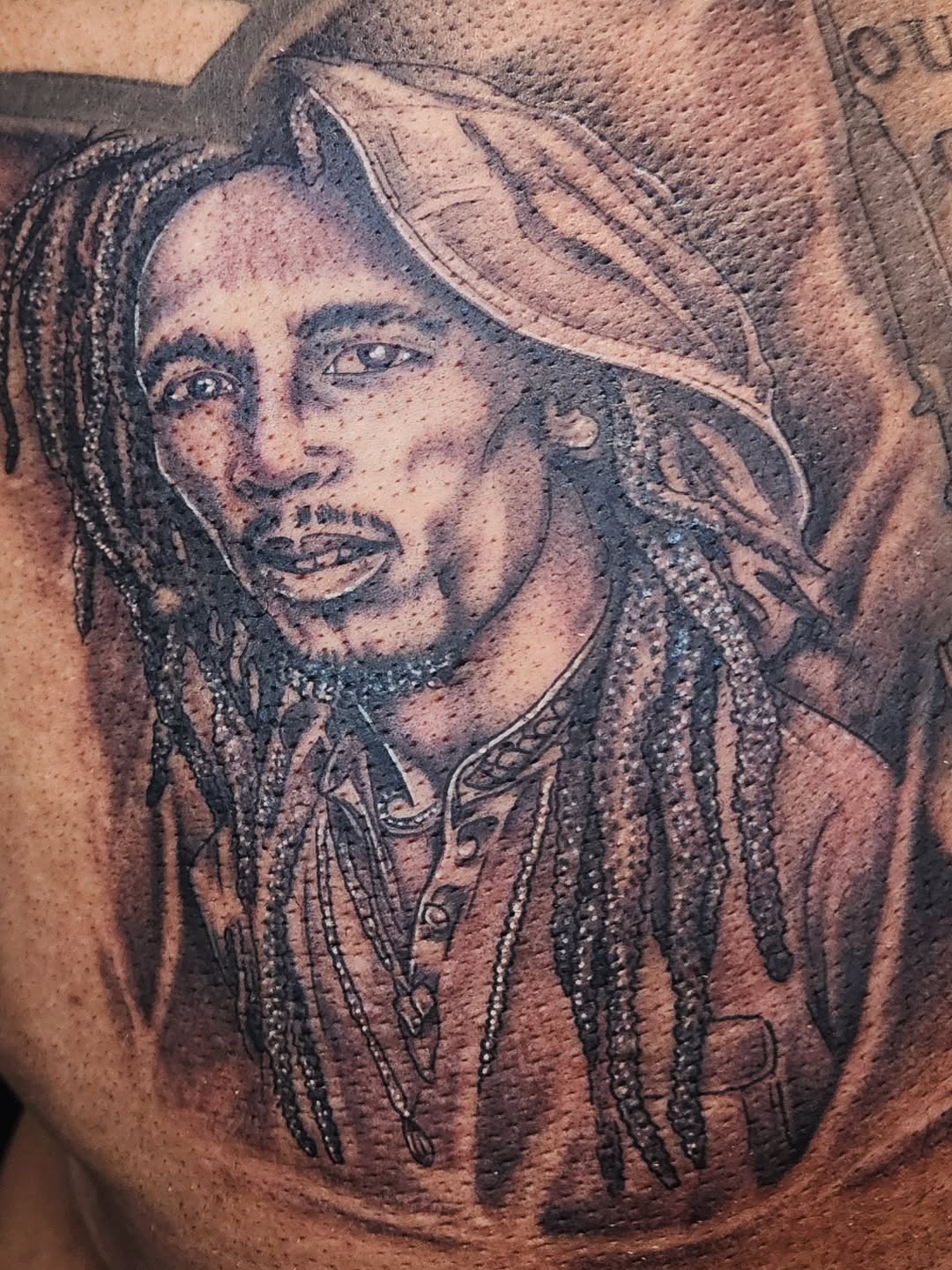 Tattoo by @consumer.inkslinger.artist — realism, black_and_grey