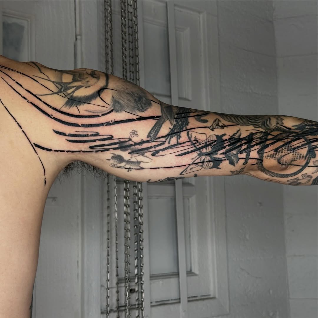 Tattoo by @good.boi.ink — blackwork, illustrative