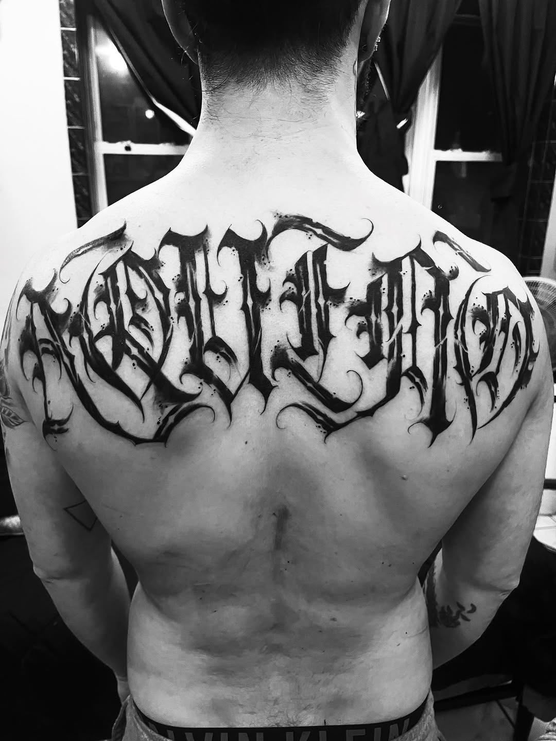 Tattoo by @jokertattoos — lettering_script, blackwork