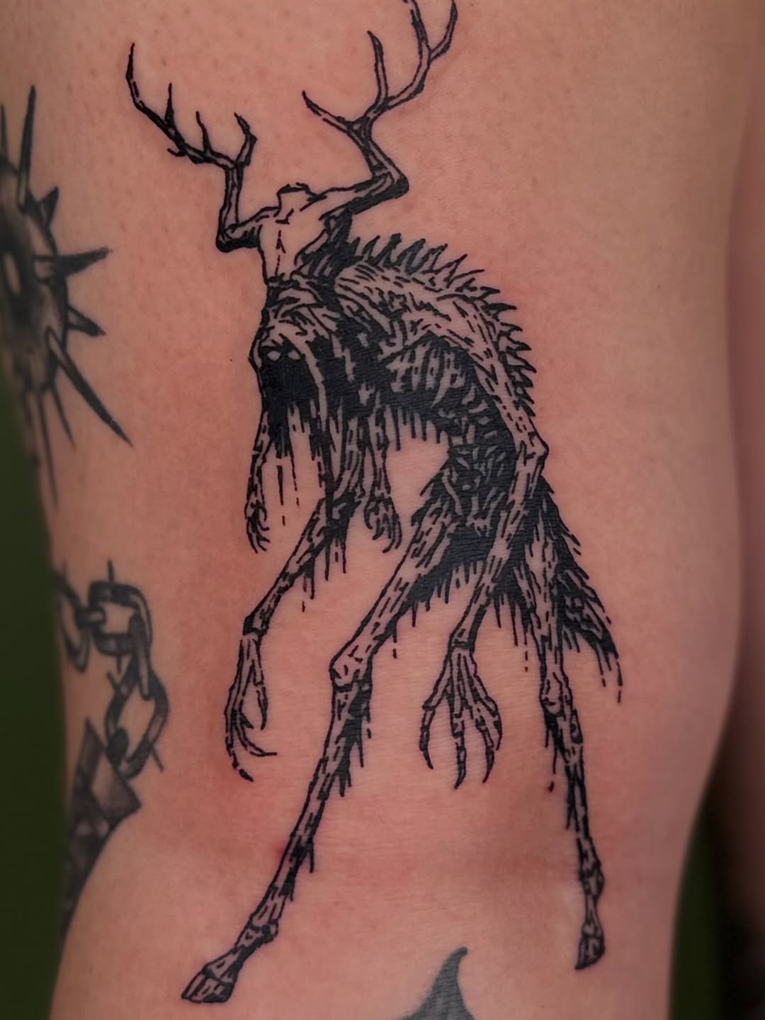 Tattoo by @tapiotats — illustrative, blackwork