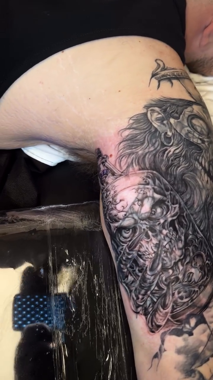 Tattoo by @vudoo_tattoo — dark_realism, black_and_grey