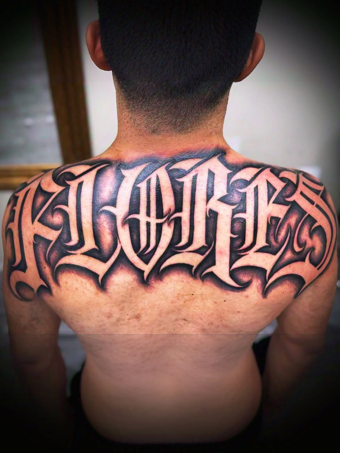 Tattoo by @cesarbee — lettering_script, black_and_grey