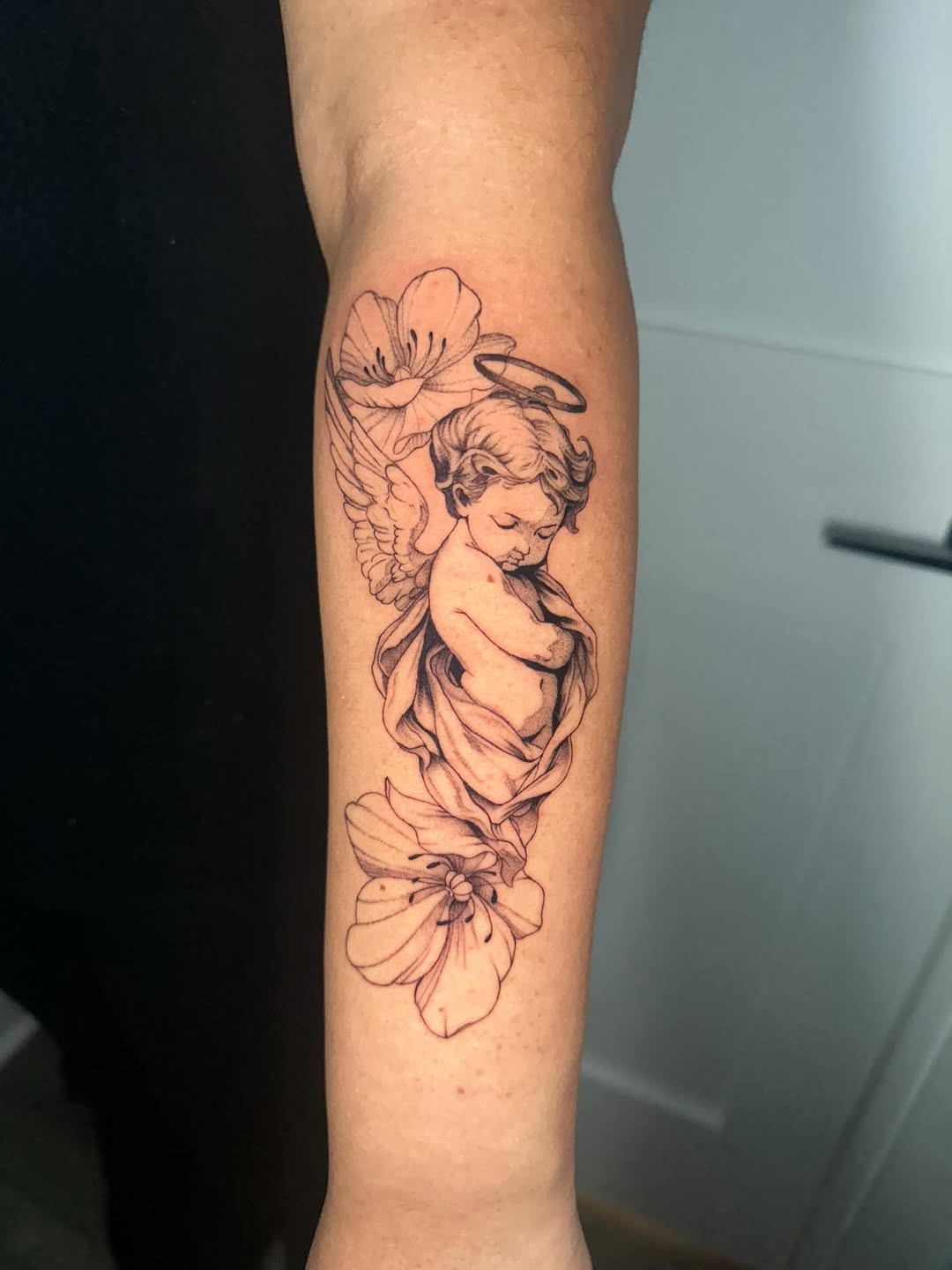 Tattoo by @nia.c__tattoo — fine_line, black_and_grey