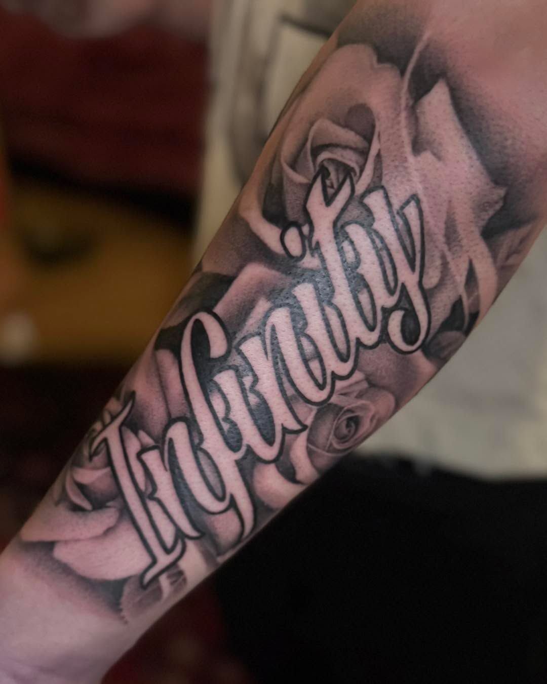 Tattoo by @_haloink_ — lettering_script, black_and_grey