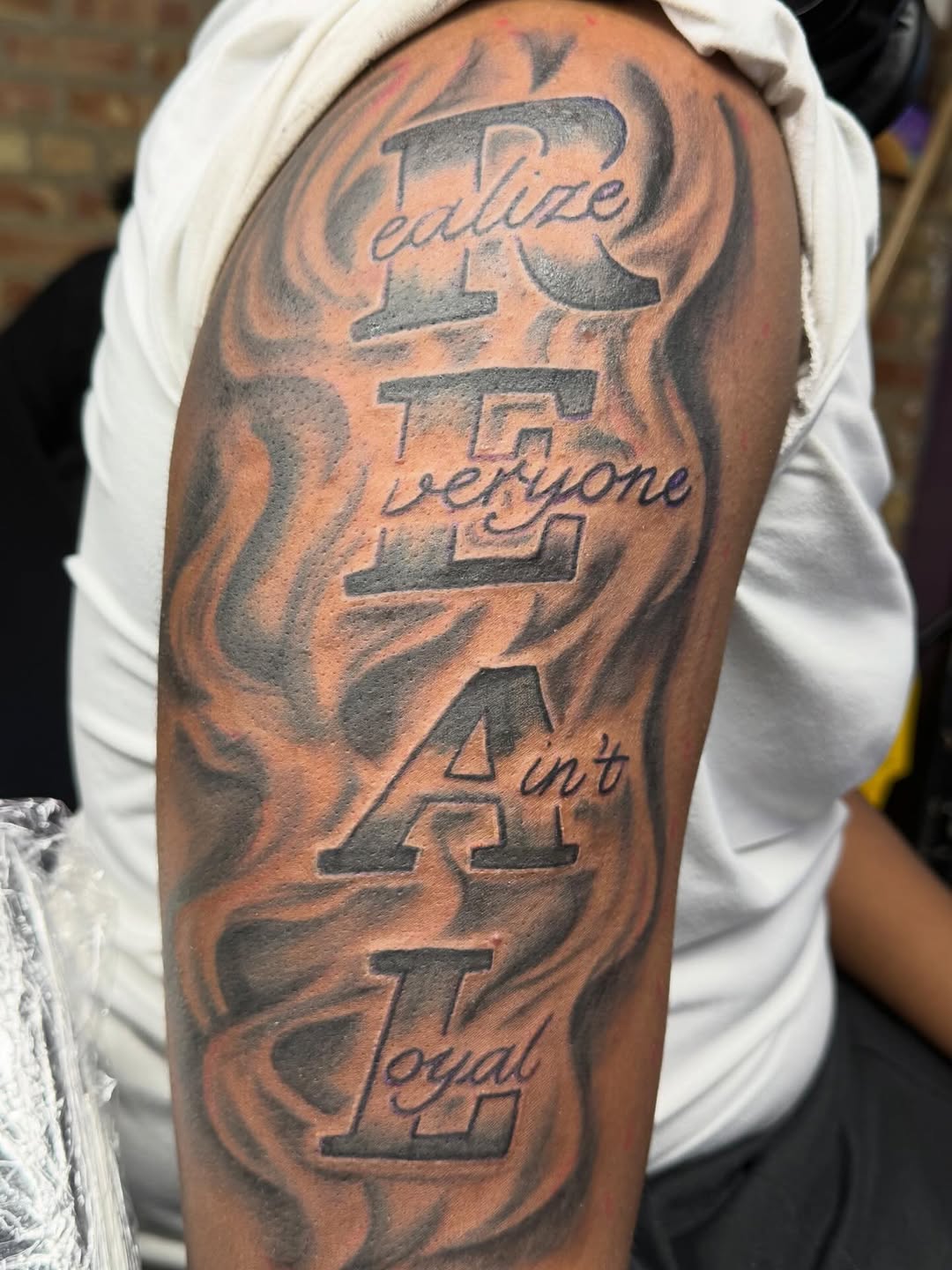 Tattoo by @lulutatt2s — lettering_script, black_and_grey