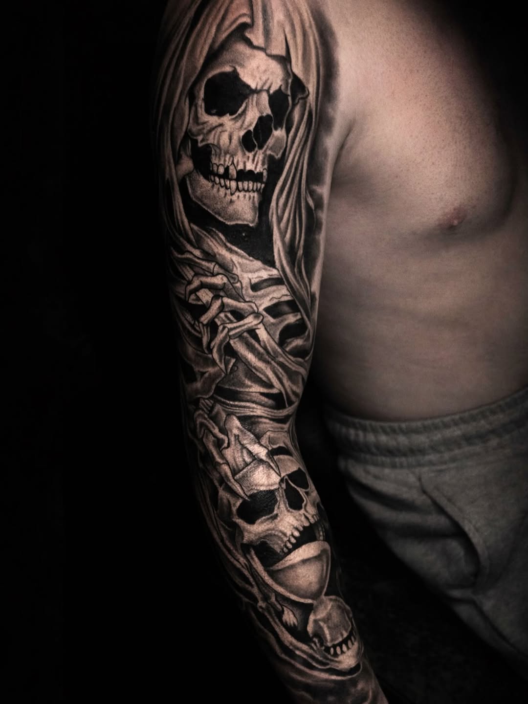 Tattoo by @el_maui787 — dark_realism, black_and_grey