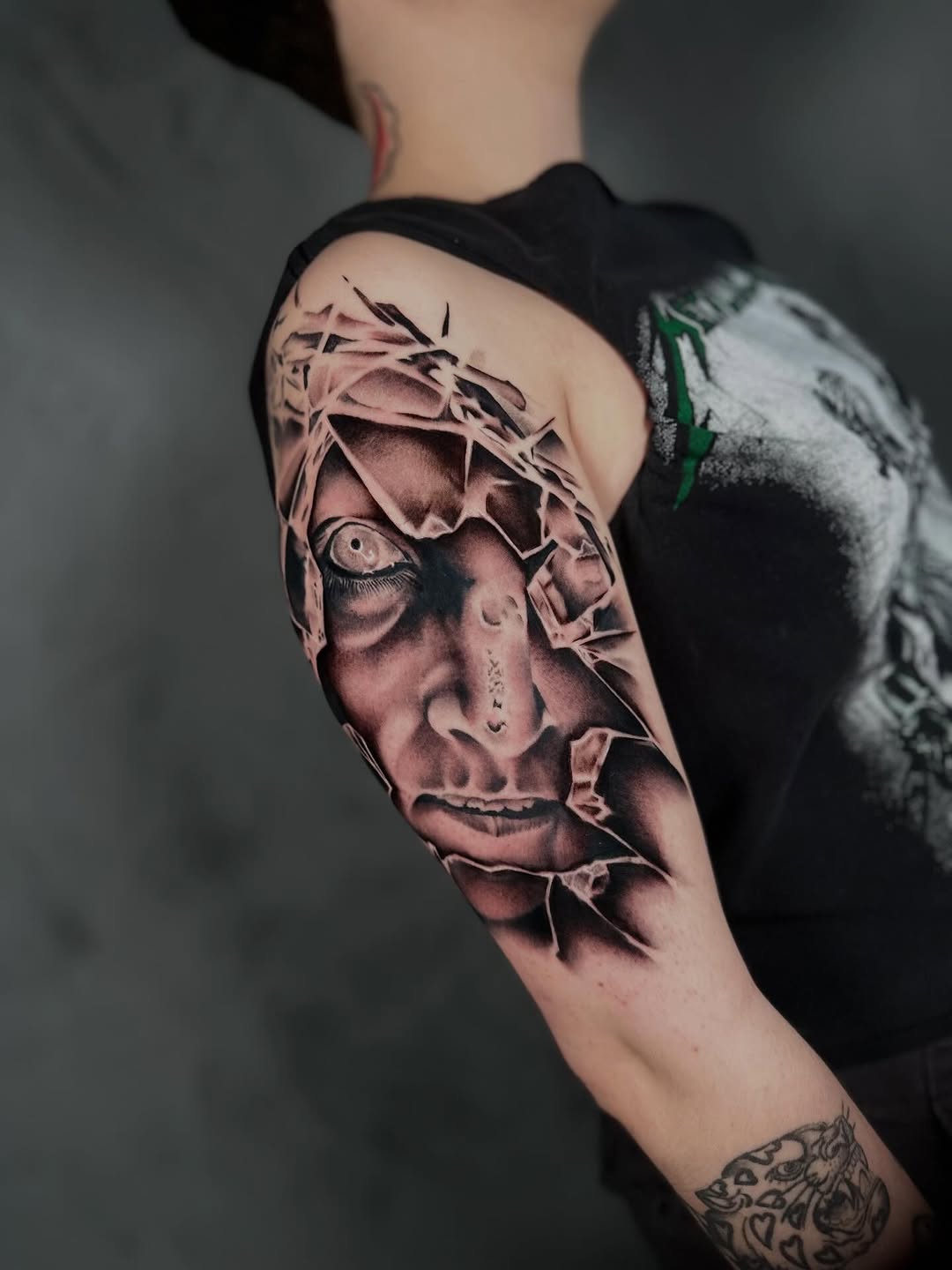 Tattoo by @dxmon.ttt โ realism, black_and_grey