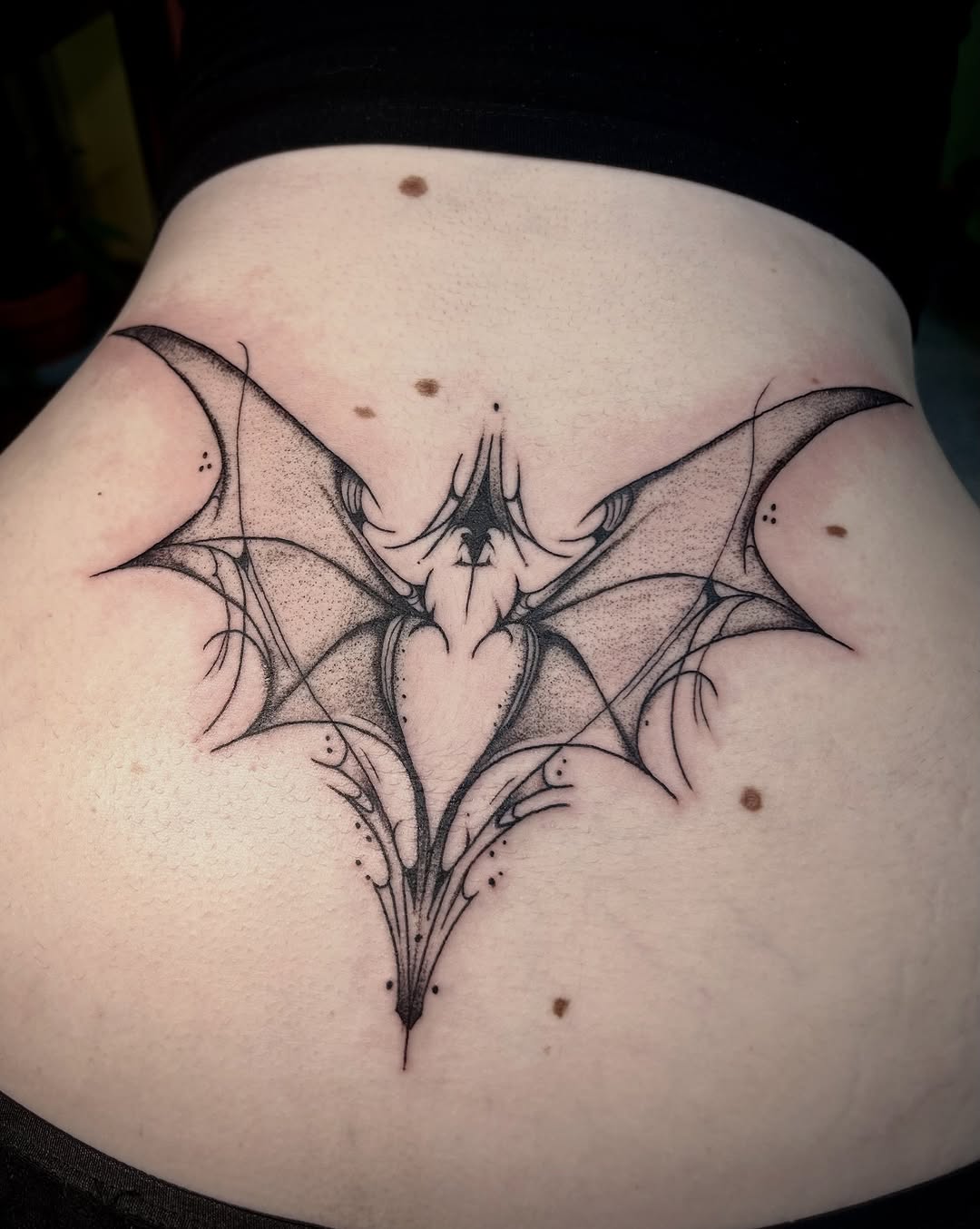Tattoo by @bloodybriaa — illustrative, dotwork