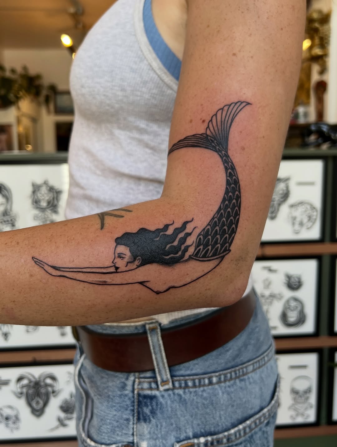 Tattoo by @syrenbier — illustrative, blackwork