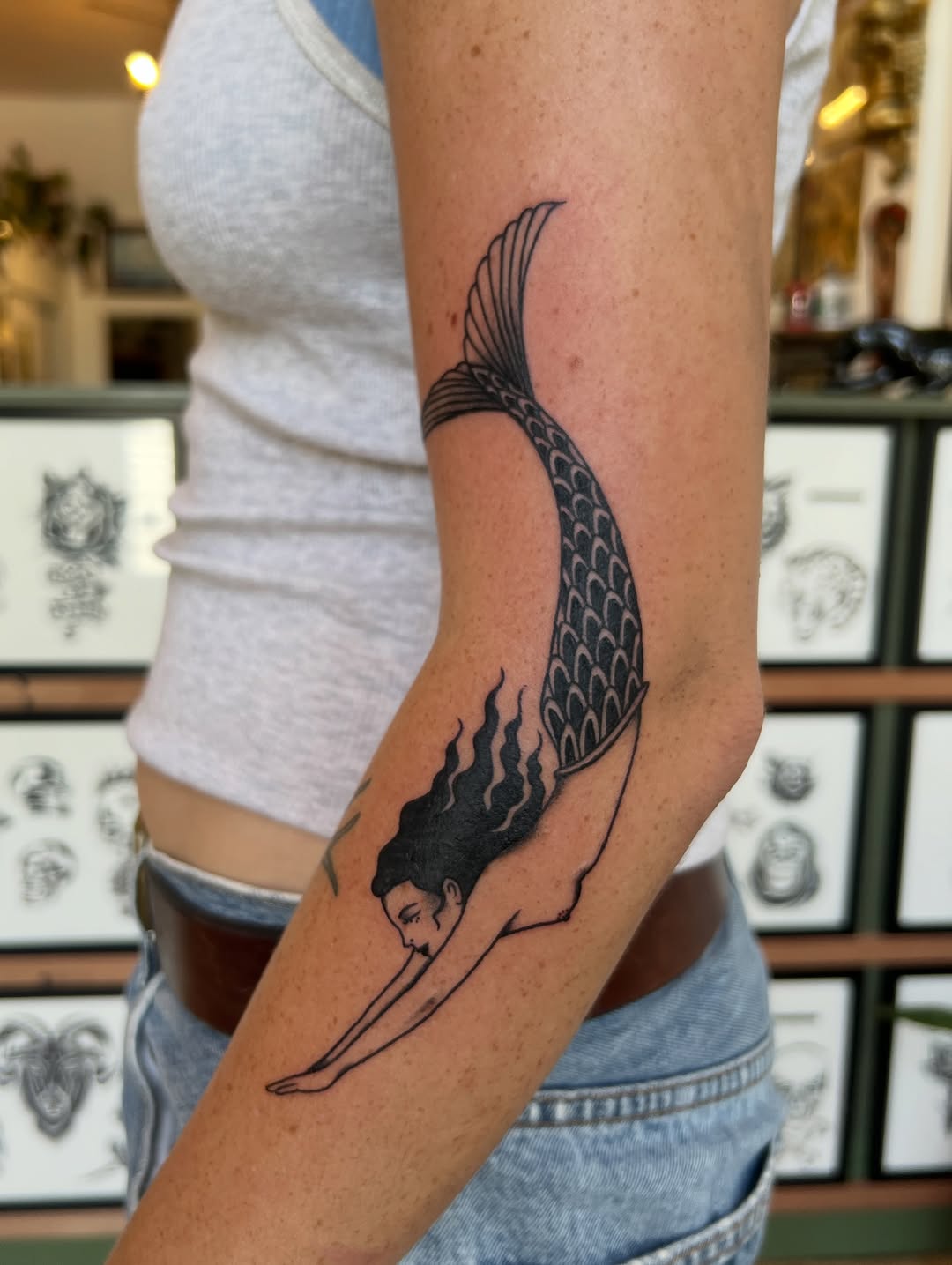 Tattoo by @syrenbier — illustrative, blackwork