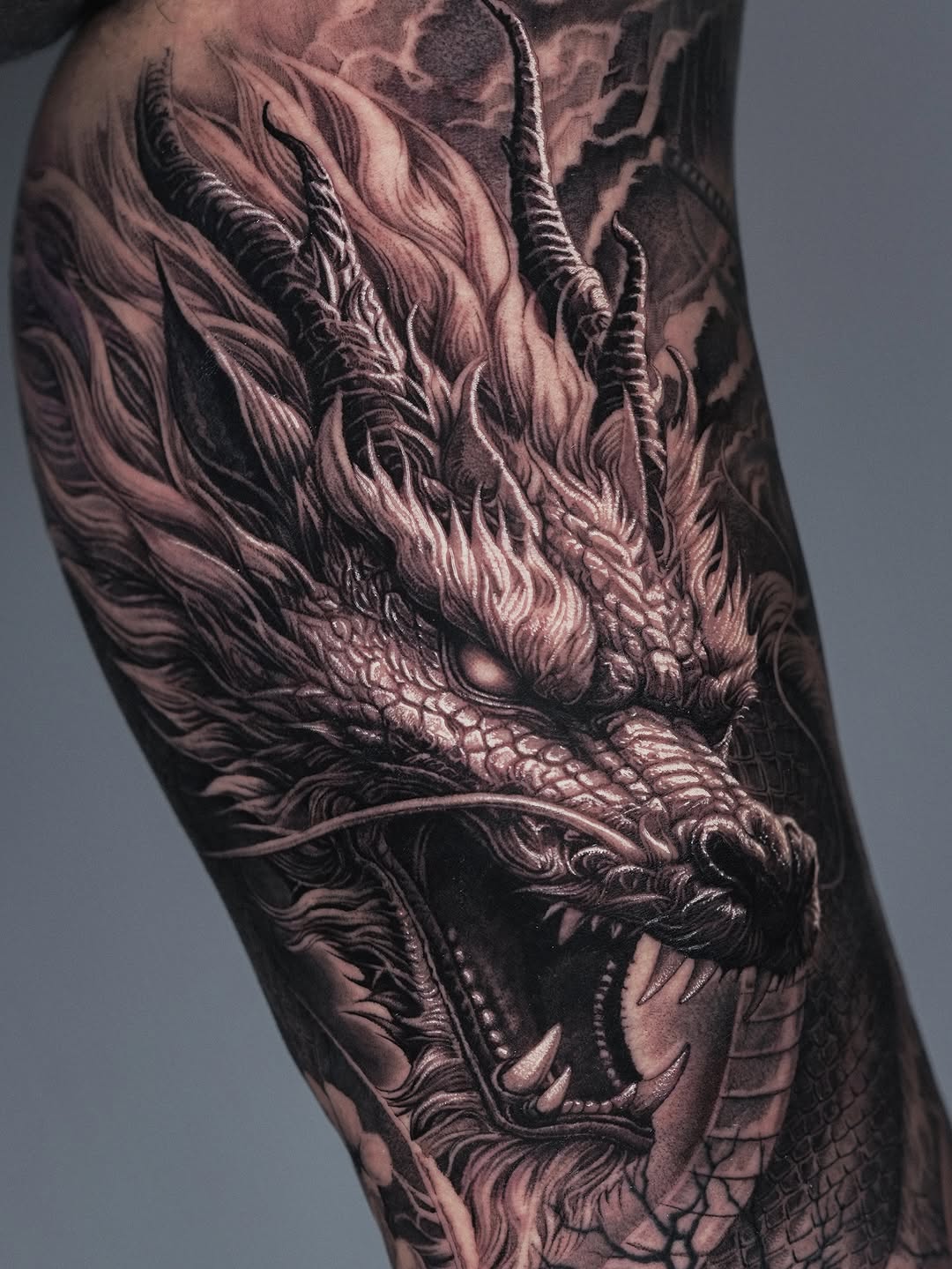 Tattoo by @sumok_tattoo β realism, black_and_grey