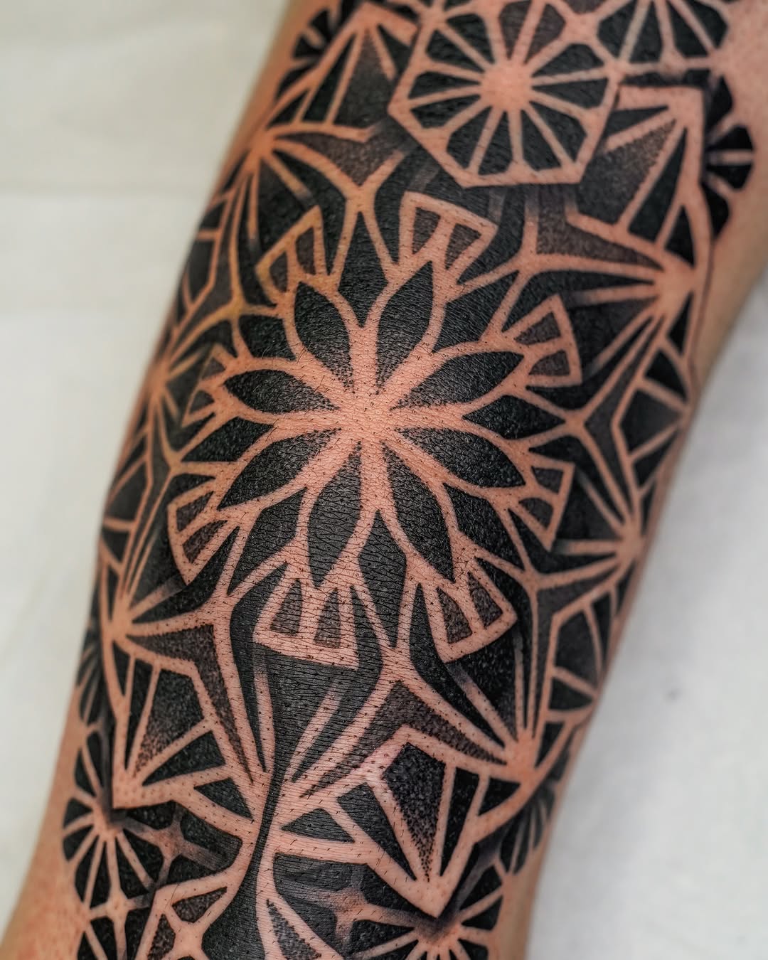 Tattoo by @rjxdots — geometric, dotwork