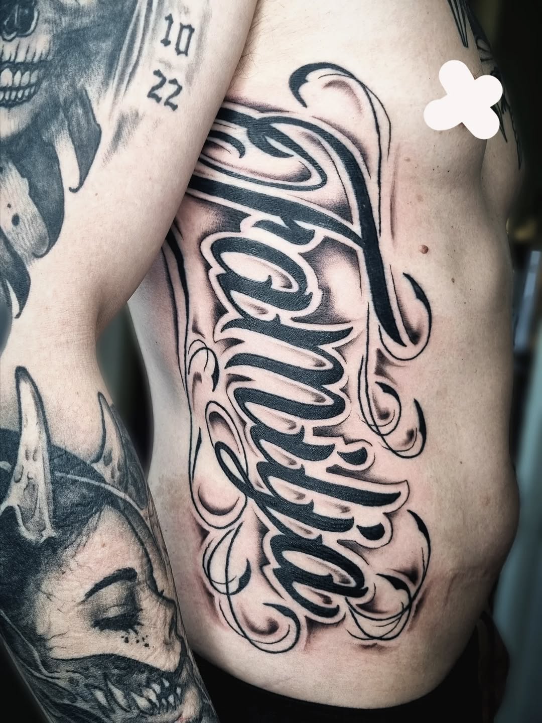 Tattoo by @antihero_tattoo — lettering_script, blackwork