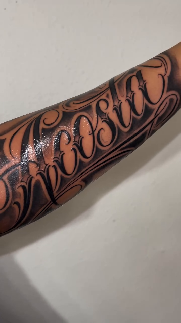 Tattoo by @miguelfernandez_tattoo — lettering_script, chicano