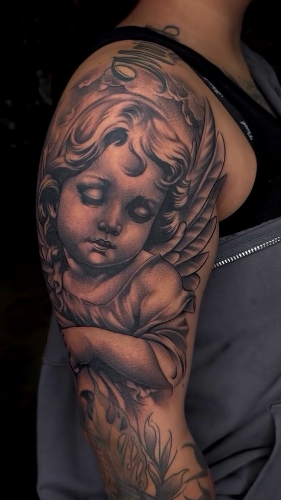 Tattoo by @marcos_tattoos — realism, black_and_grey