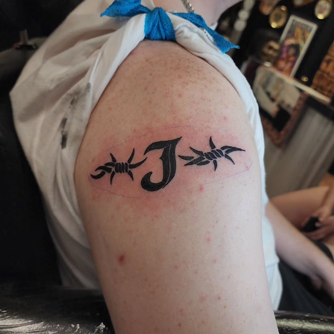 Tattoo by @bigtastytattoos — lettering_script, blackwork