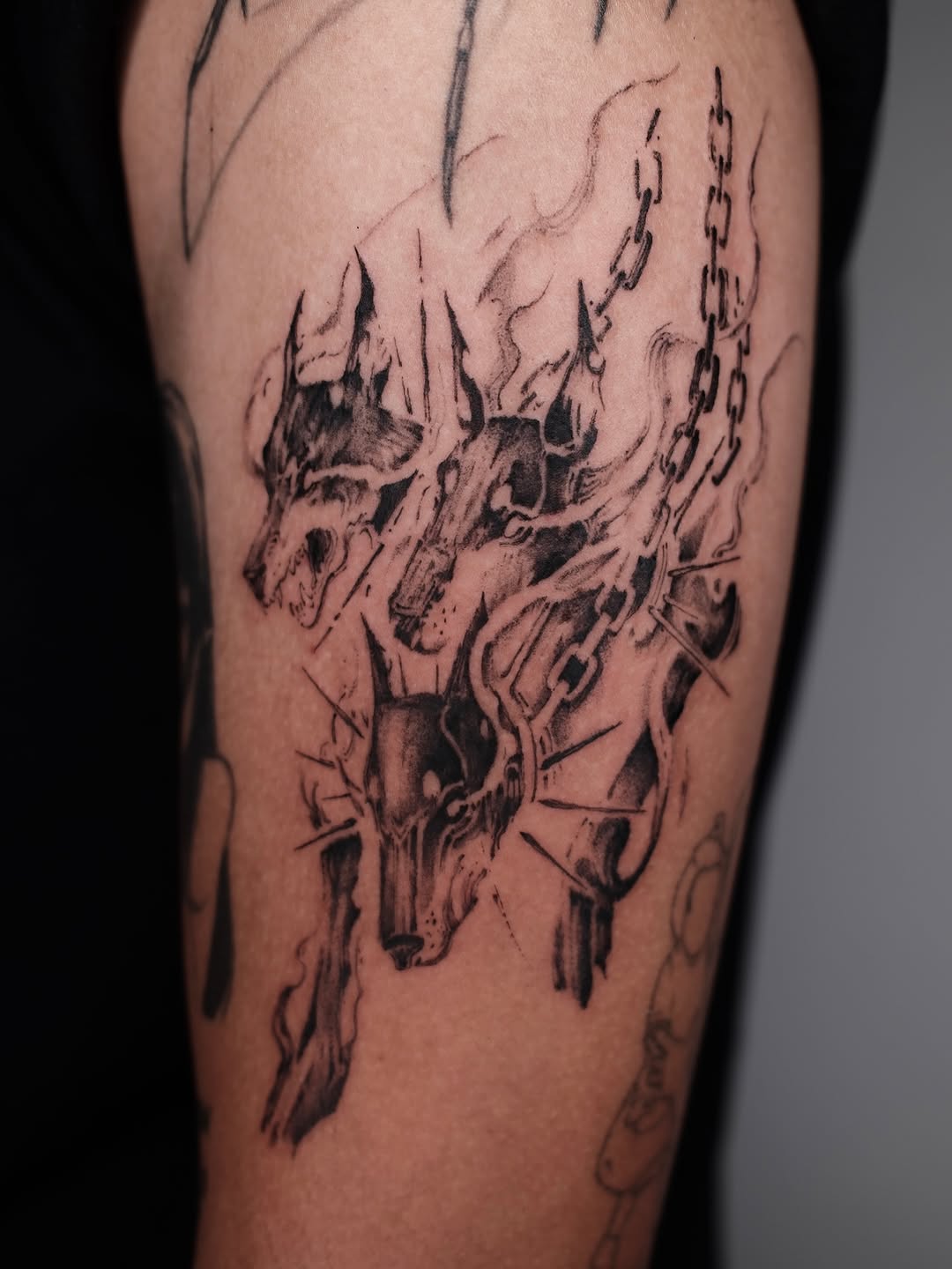 Tattoo by @rayzhu.tattoo — black_and_grey, dark_realism