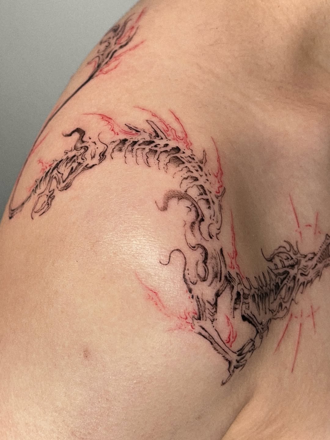 Tattoo by @rayzhu.tattoo — blackwork, illustrative