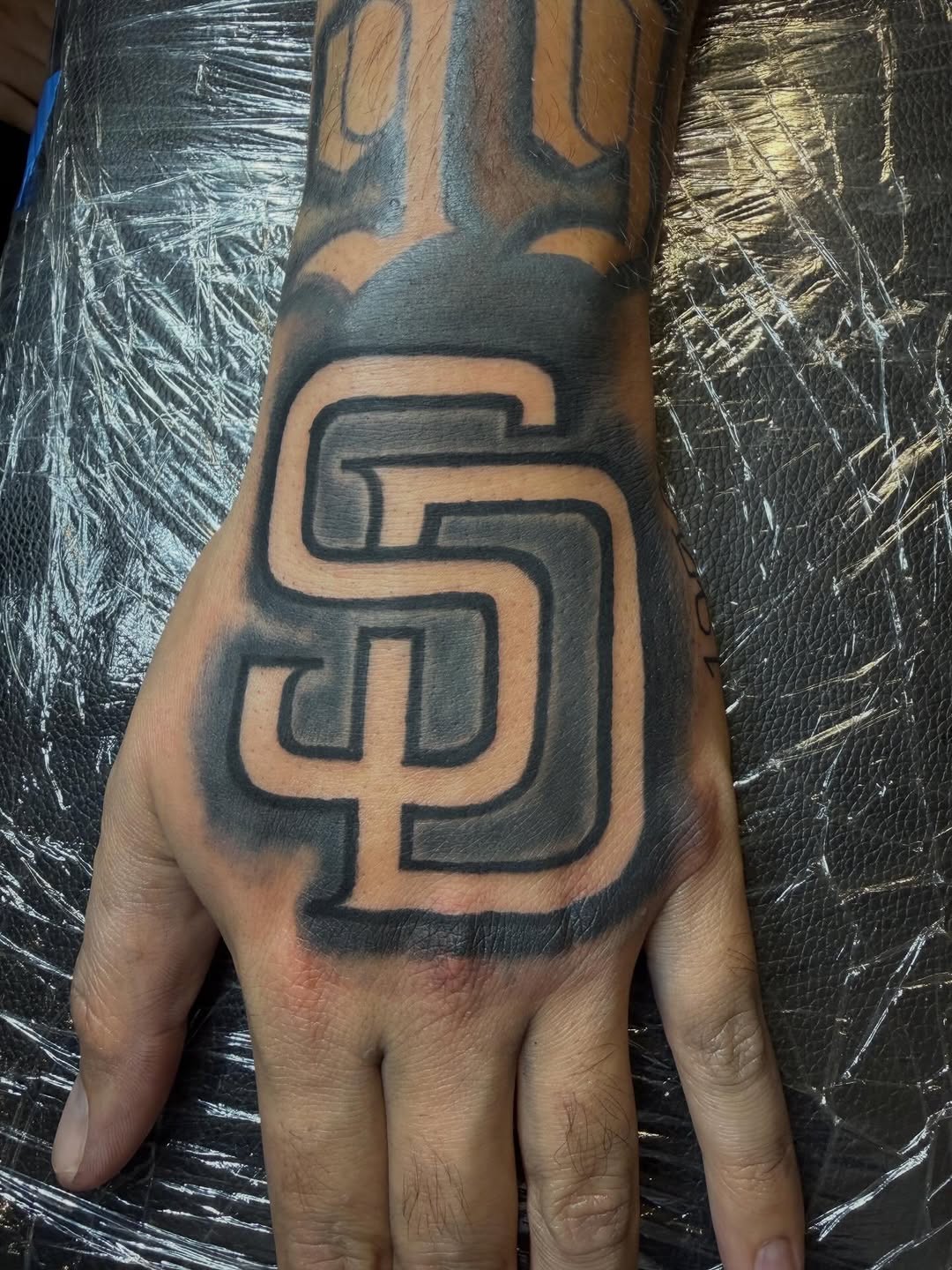 Tattoo by @offdosage.tats โ blackwork, lettering_script