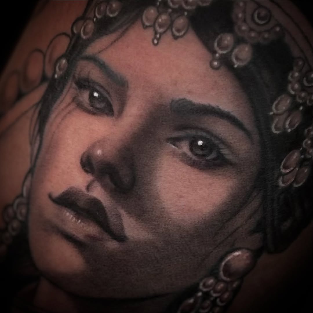 Tattoo by @stretched.marks.tattoo — realism, black_and_grey