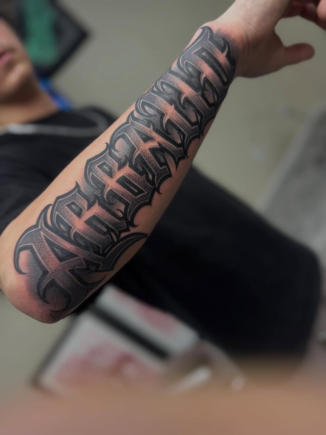 Tattoo by @cesarbee — lettering_script, black_and_grey