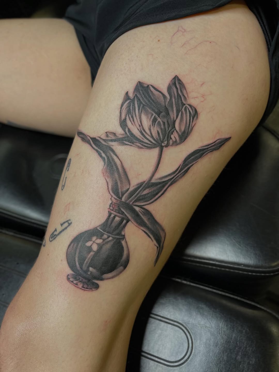 Tattoo by @velvet.snails — realism, black_and_grey
