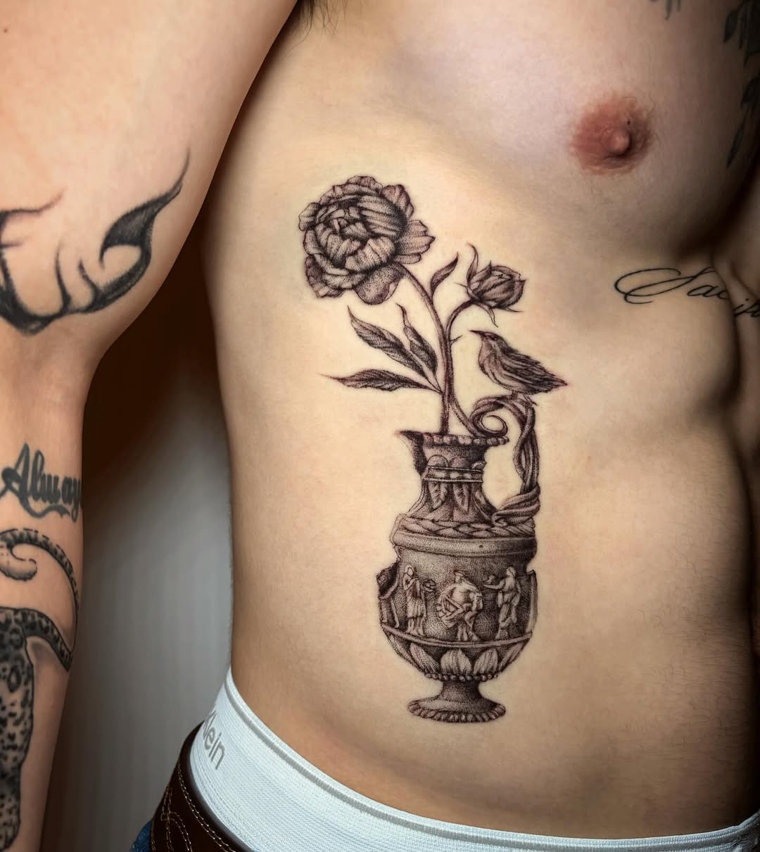 Tattoo by @liz.tattooz — black_and_grey, illustrative