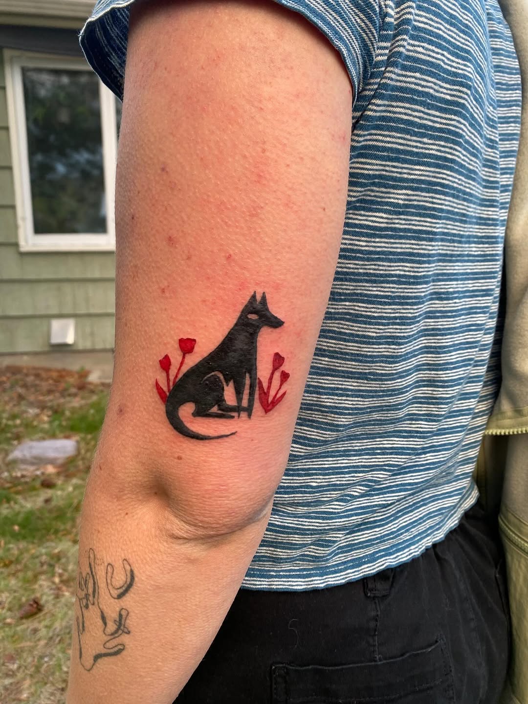 Tattoo by @littleblackdogtattoo — blackwork, minimalist