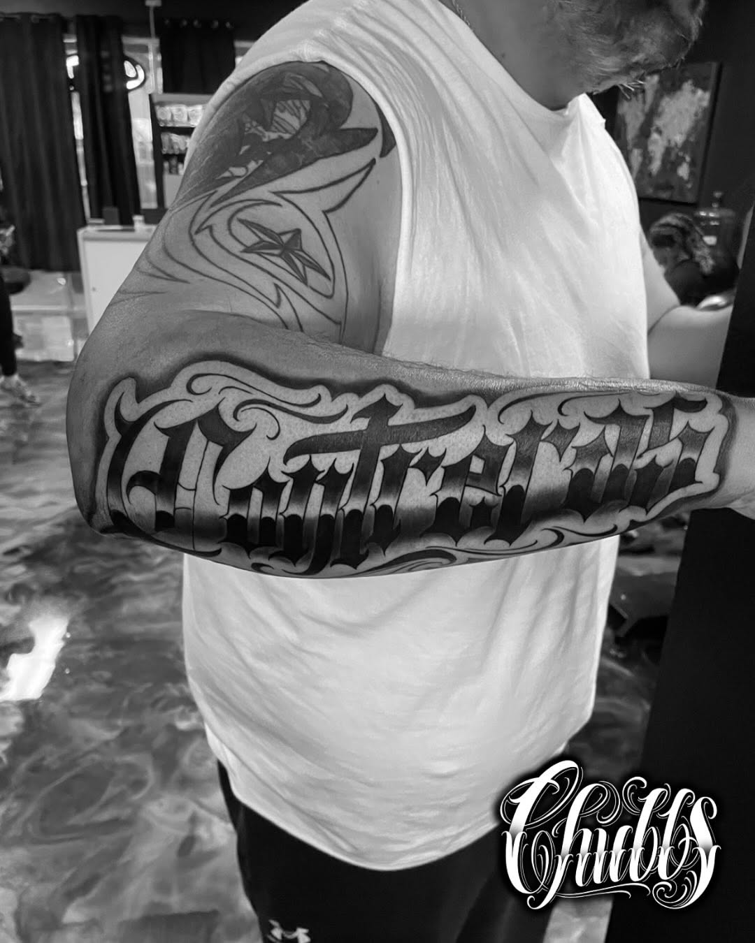 Tattoo by @tatsbychubbs — chicano, lettering_script