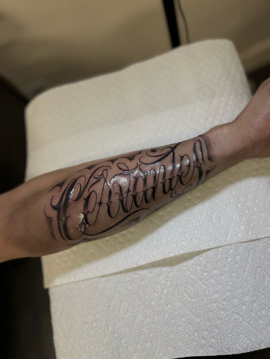 Tattoo by @tavoromero_19 — lettering_script, blackwork