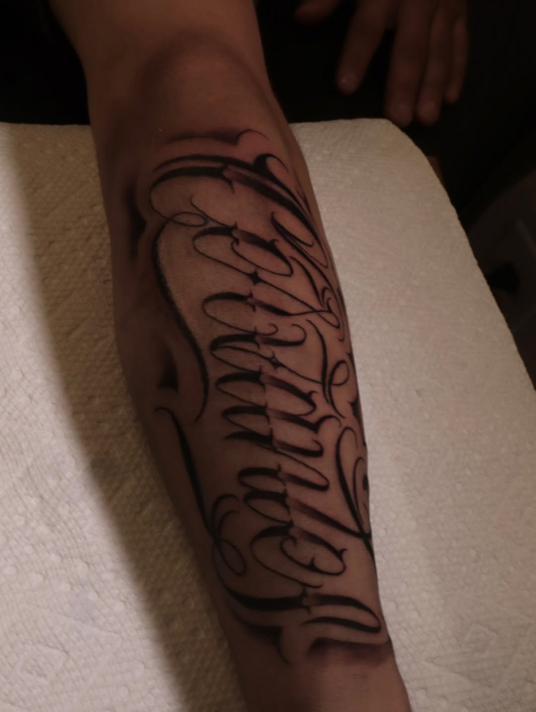 Tattoo by @tavoromero_19 — lettering_script, chicano