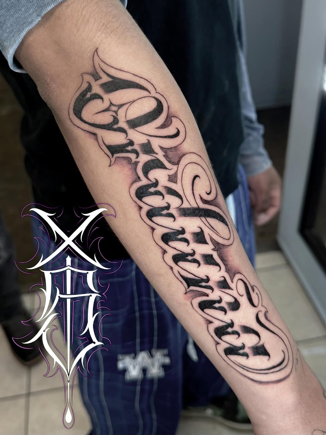 Tattoo by @stilow_ink — lettering_script, chicano