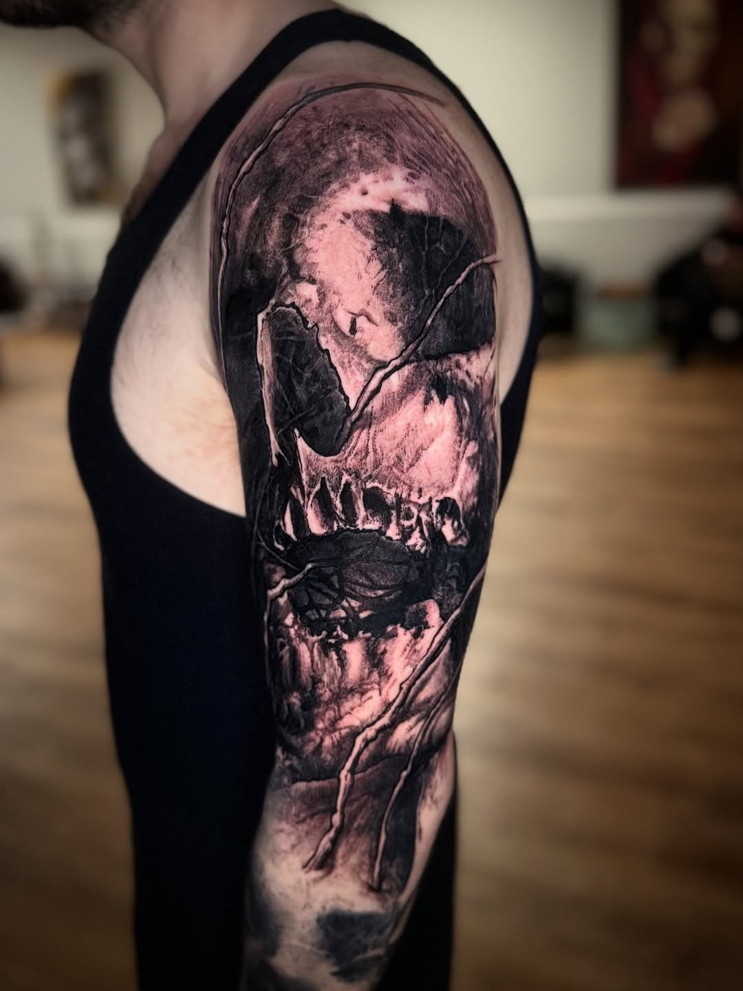 Tattoo by @bigbadwolftattoos — dark_realism, black_and_grey