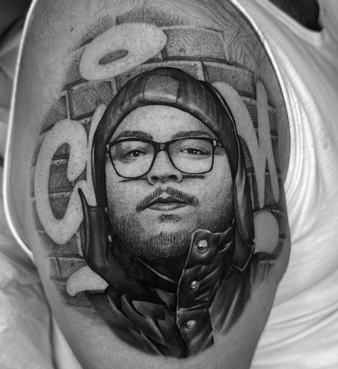 Tattoo by @manzur_no.name — realism, black_and_grey
