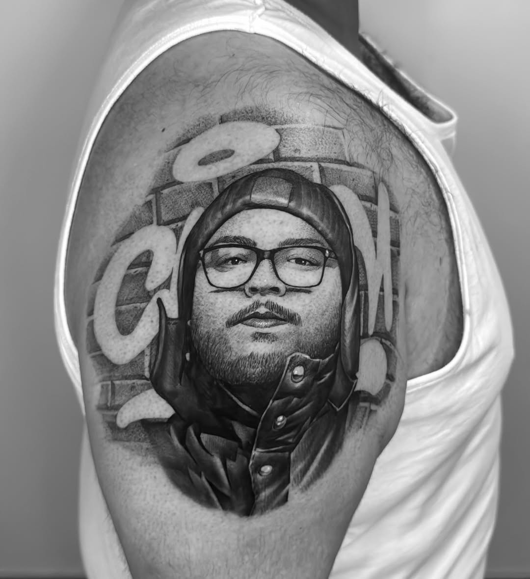 Tattoo by @manzur_no.name — realism, black_and_grey
