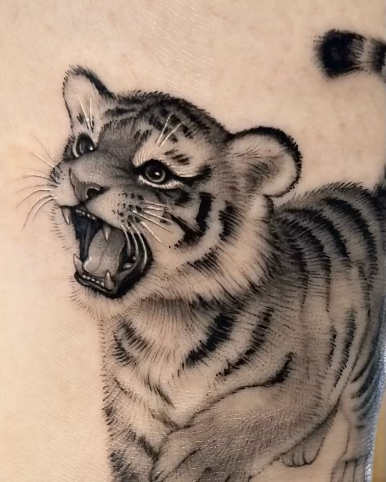 Tattoo by @tiny_tim.tatts โ realism, black_and_grey
