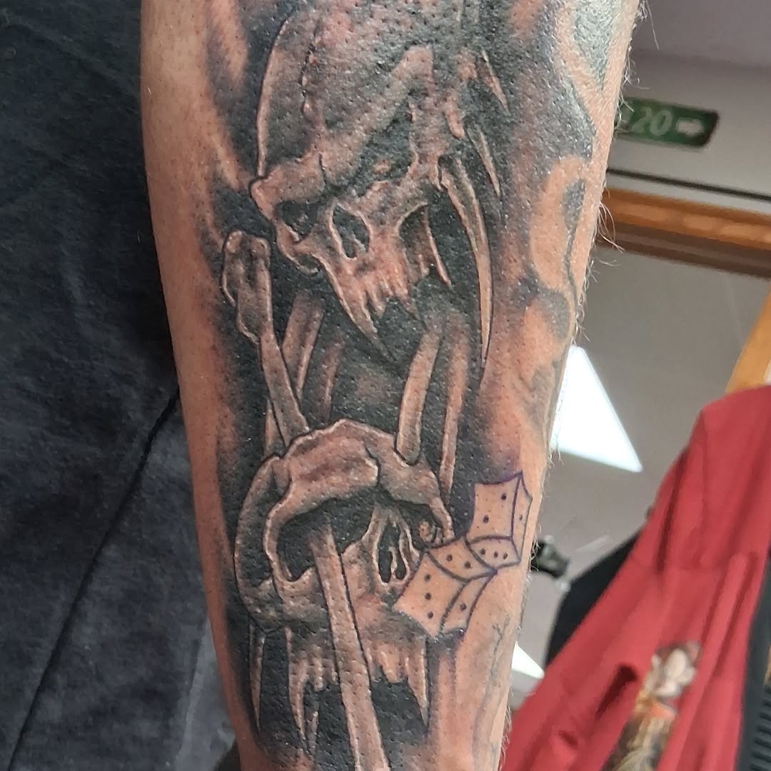 Tattoo by @tattoodaveatlivingcanvastattoo — black_and_grey, dark_realism