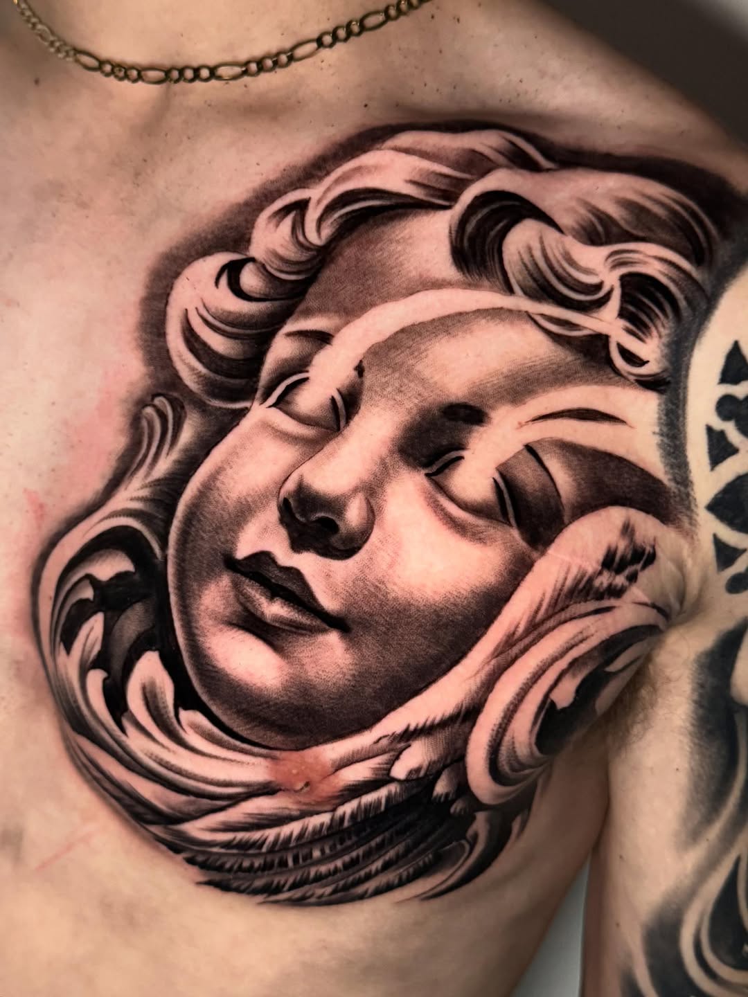 Tattoo by @saeso___ — realism, black_and_grey