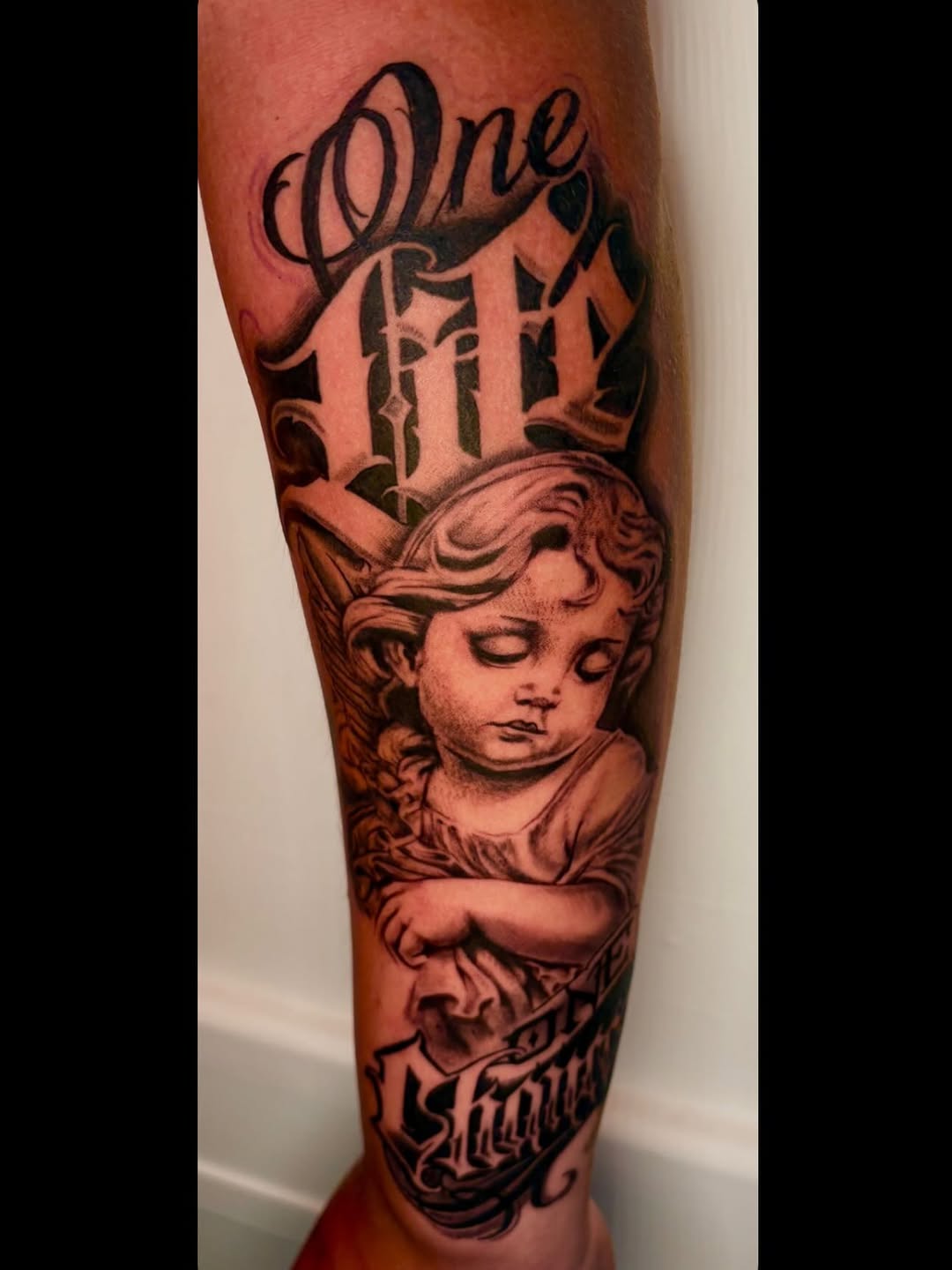 Tattoo by @inks.by.spider — realism, lettering_script