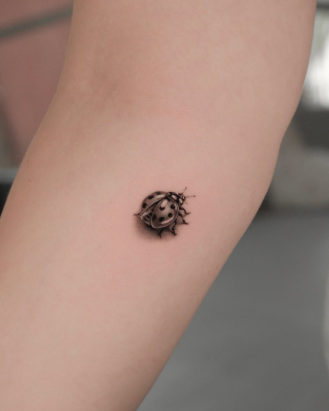Tattoo by @dionne.tattoo โ realism, black_and_grey