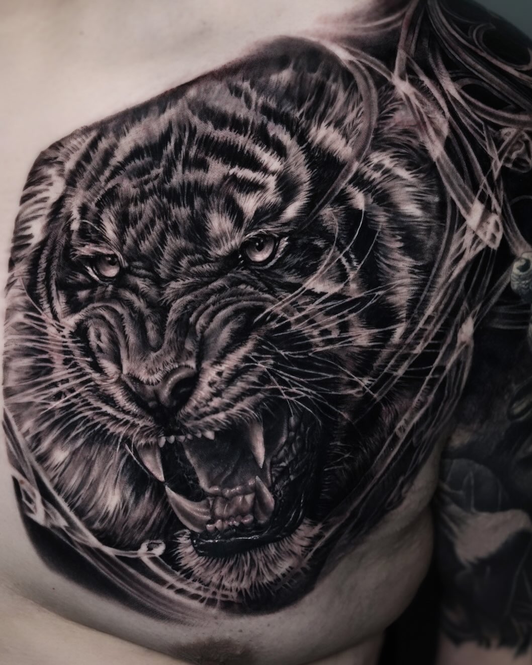Tattoo by @tattooist_pitasso — realism, black_and_grey