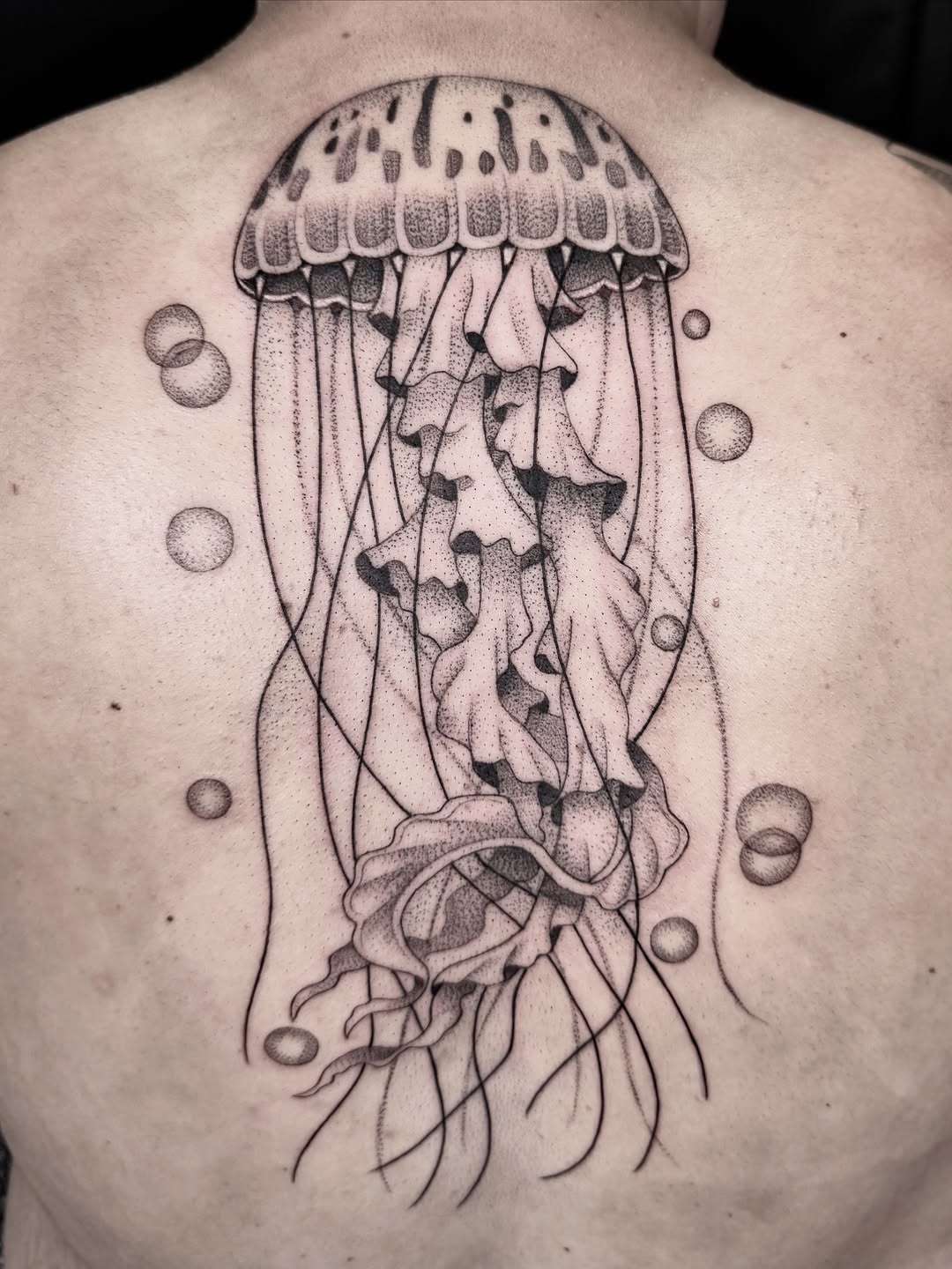 Tattoo by @milesromerotattoos — dotwork, black_and_grey