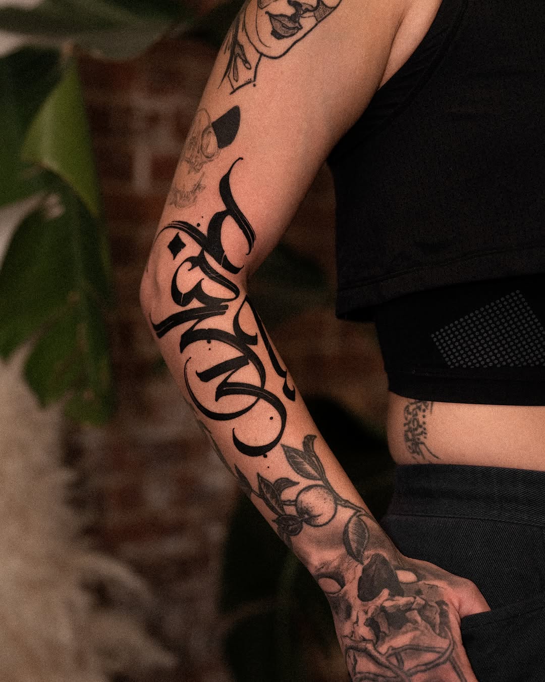 Tattoo by @low.original — lettering_script, blackwork